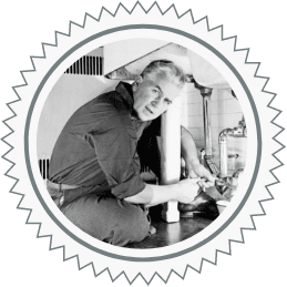 Black and white photo of HVAC technician fixing a drain issue for homeowner. Image for Plumb Pros Inc. plumbing service section.